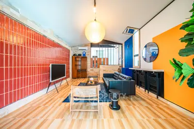 Stylish modern living room with unique design and vibrant colors