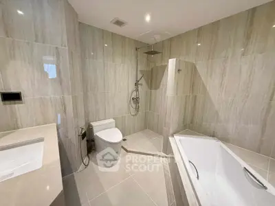 Luxurious modern bathroom with elegant fixtures and spacious bathtub