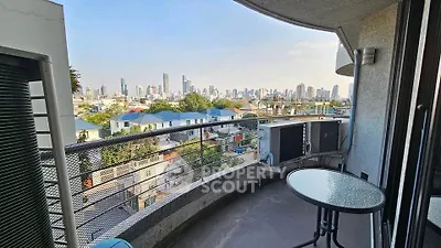 Stunning cityscape view from spacious balcony in modern apartment