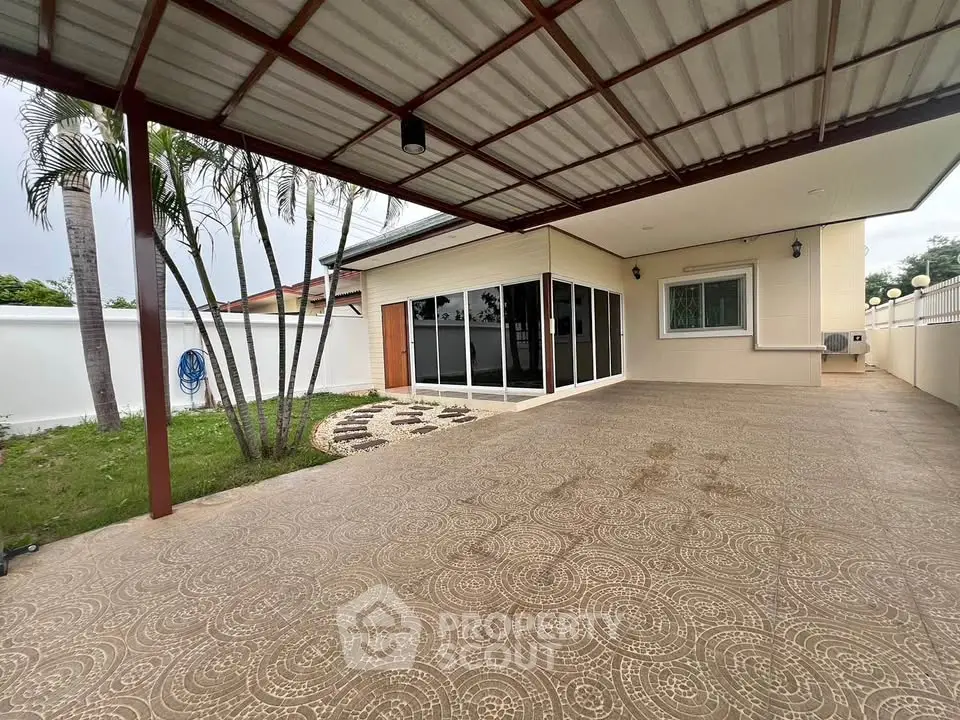 Spacious covered patio with garden view in modern home