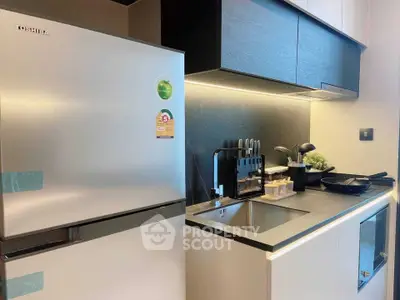 Modern kitchen with sleek appliances and minimalist design