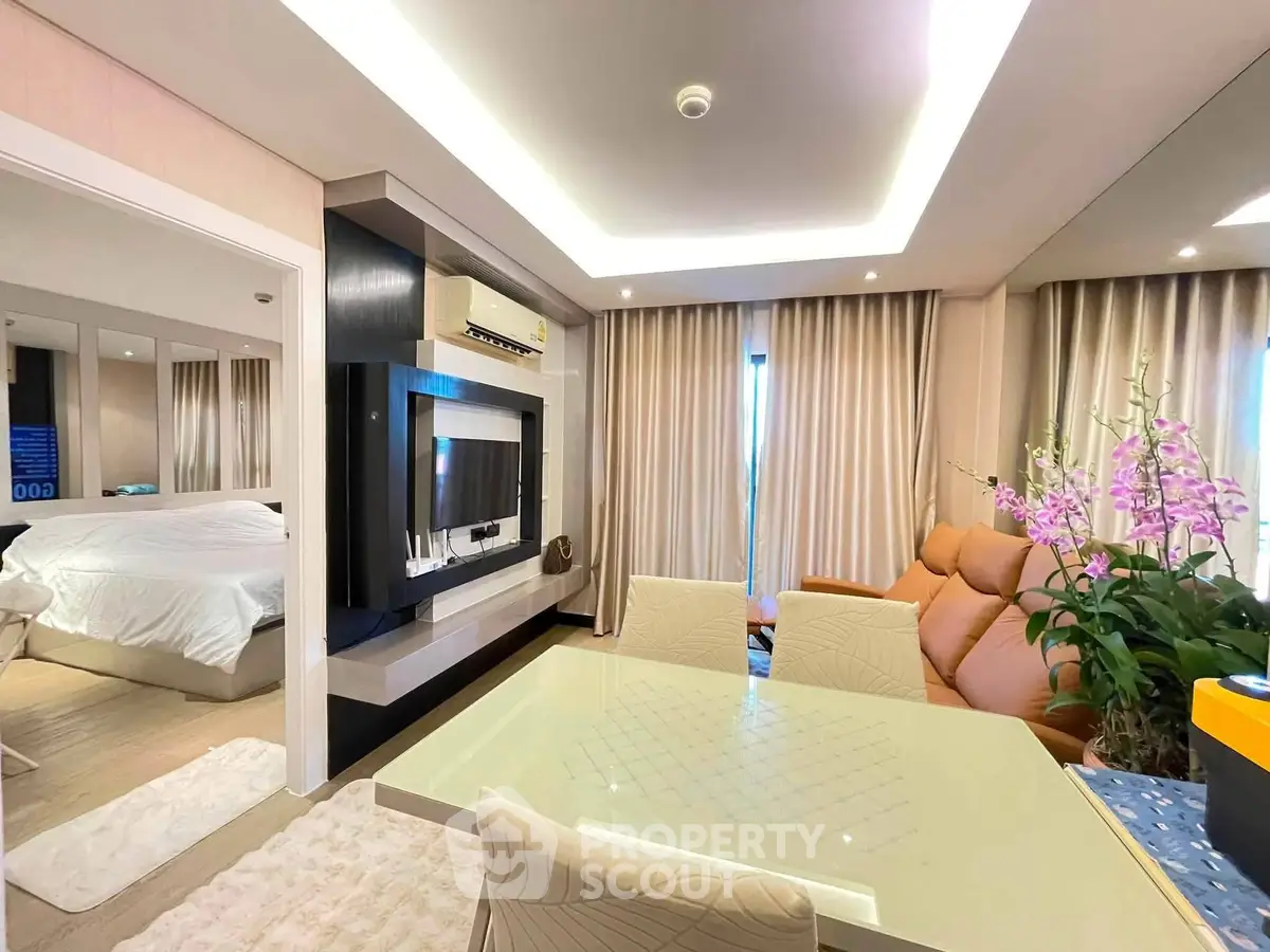 Luxurious modern living room with elegant dining area and cozy bedroom view