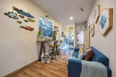 Charming living room with artistic decor and cozy seating in modern apartment