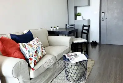 Modern living room with cozy sofa and stylish decor in a contemporary apartment.