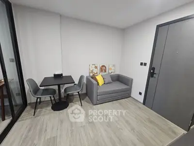 Modern living room with cozy sofa and dining area in stylish apartment.