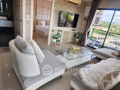 Luxurious living room with modern decor and stunning balcony view
