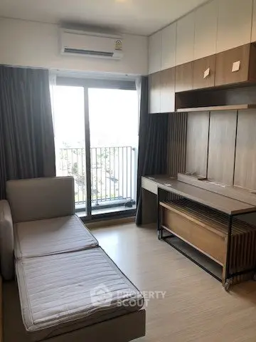 Modern bedroom with balcony access and stylish wooden furniture