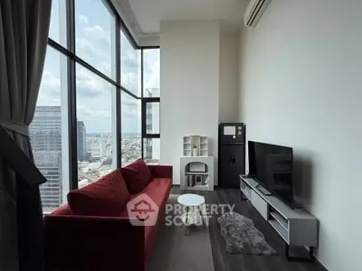 Modern living room with floor-to-ceiling windows and city view