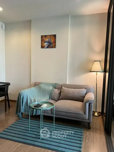 Cozy living room with modern decor and stylish furniture, perfect for relaxation.