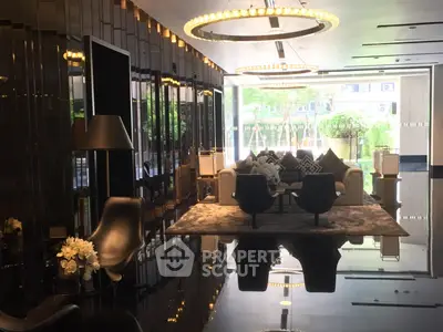 Luxurious modern living room with elegant decor and large windows offering garden views.