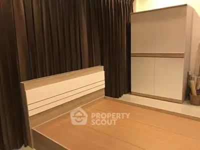 Modern bedroom with stylish wooden bed and sleek wardrobe design