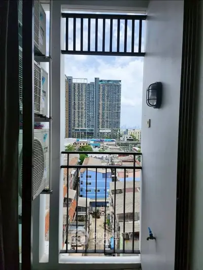 Urban balcony view with cityscape and modern high-rise buildings