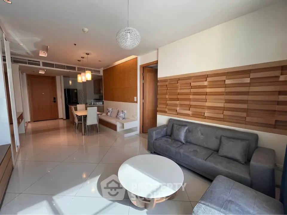 Modern living room with stylish decor and open dining area