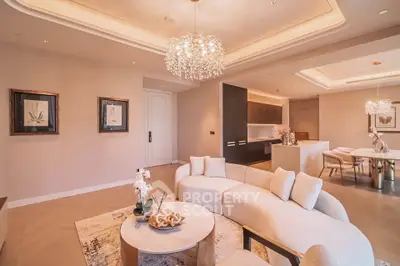 Luxurious open-plan living room with elegant chandelier and modern decor