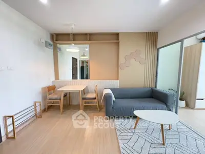 Modern living room with stylish furniture and wooden accents, perfect for cozy gatherings.