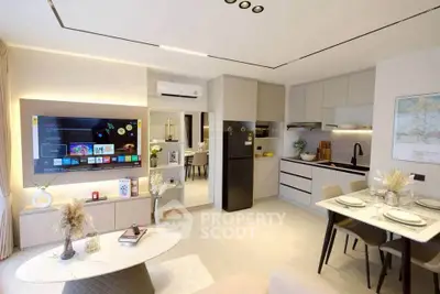 Modern open-plan living room and kitchen with sleek design and cozy dining area.