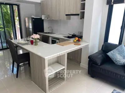 Modern kitchen with open layout and stylish island in bright apartment