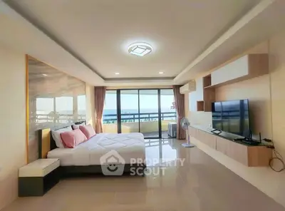 Spacious modern bedroom with sea view and large balcony access