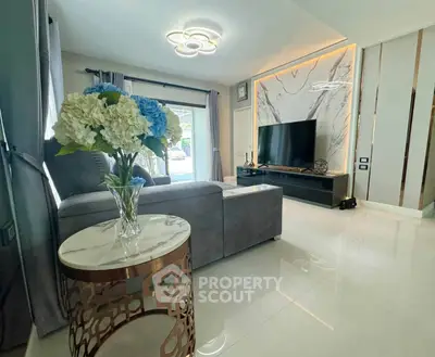 Luxurious modern living room with elegant decor and large TV