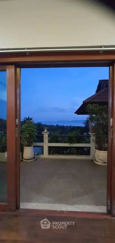 Stunning balcony view with lush greenery and serene landscape, perfect for relaxation and enjoying nature.