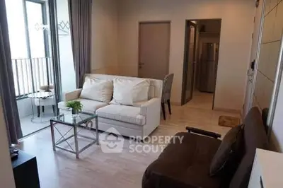 Modern living room with cozy seating and natural light