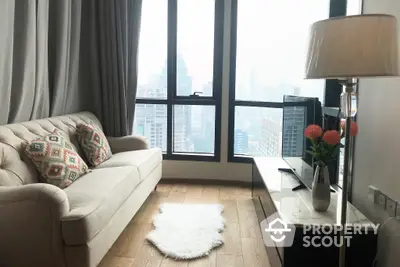 Elegant living room with plush sofa, chic decor, and floor-to-ceiling windows offering a stunning cityscape view, perfect for urban living.