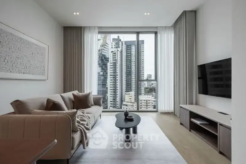 Modern living room with city view, stylish furniture, and large windows in a high-rise apartment.