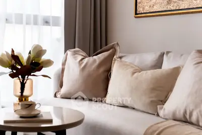 Elegant living room with plush sofa and stylish decor, perfect for modern living.