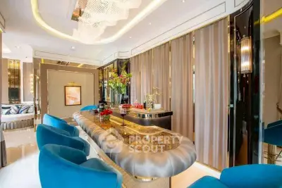 Luxurious modern living room with elegant decor and plush blue seating