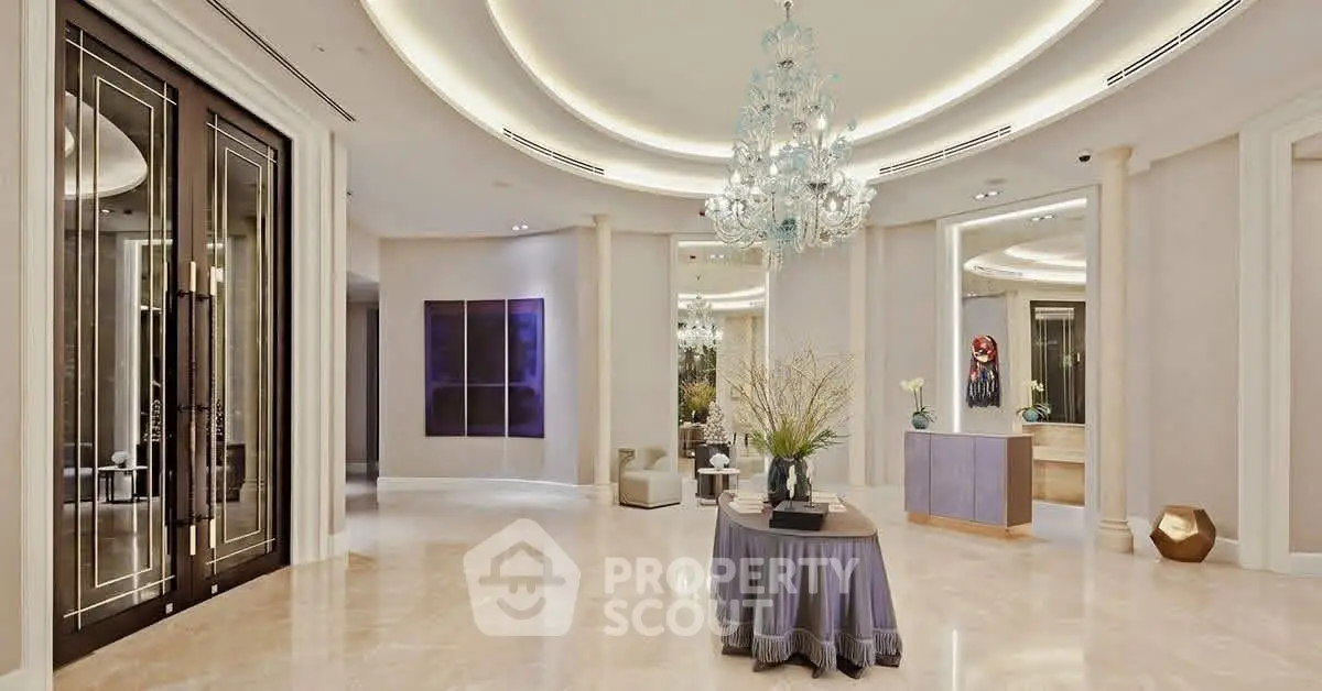 Luxurious entrance with elegant chandelier and modern decor