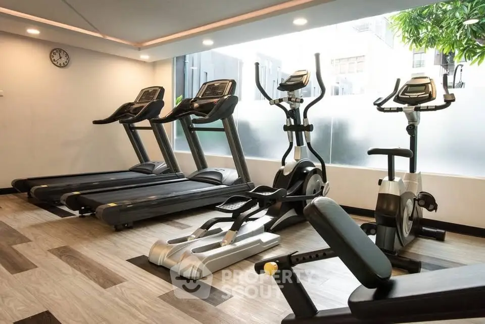 Modern gym with state-of-the-art fitness equipment and stylish interior design.