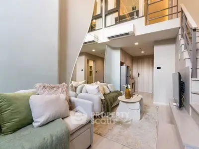 Modern loft-style living room with elegant decor and open layout
