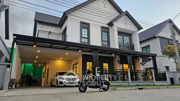 Modern two-story house with carport and stylish facade in suburban neighborhood.