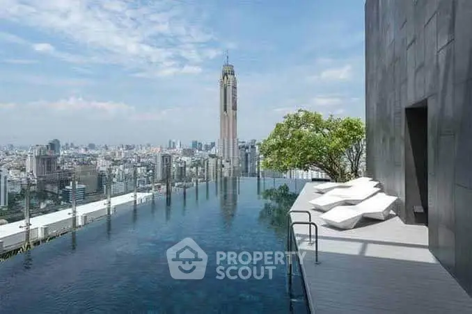 Luxurious rooftop infinity pool with stunning city skyline view and modern lounge chairs.