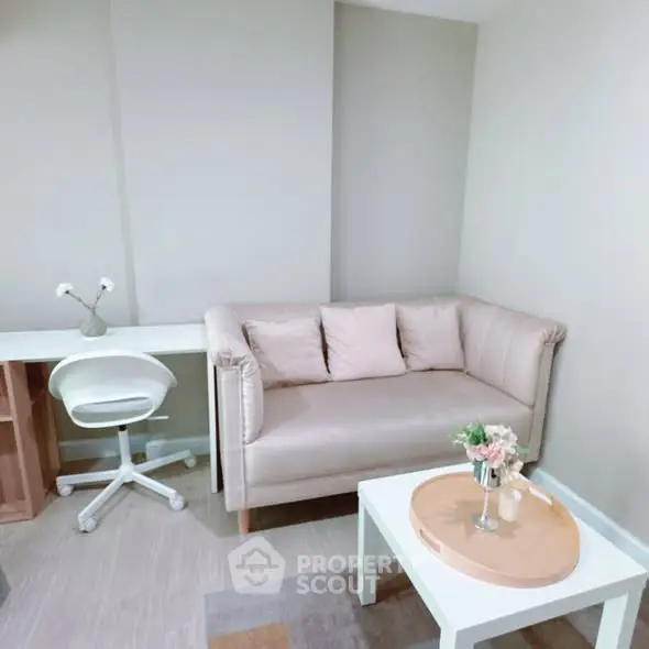 Cozy study area with modern sofa and desk in neutral tones