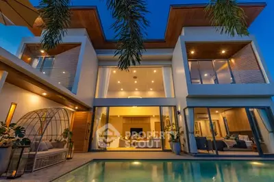 Luxurious modern villa with pool and stunning architectural design at dusk.