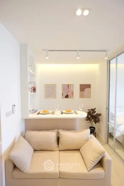 Chic modern living room with cozy beige sofa and stylish dining nook