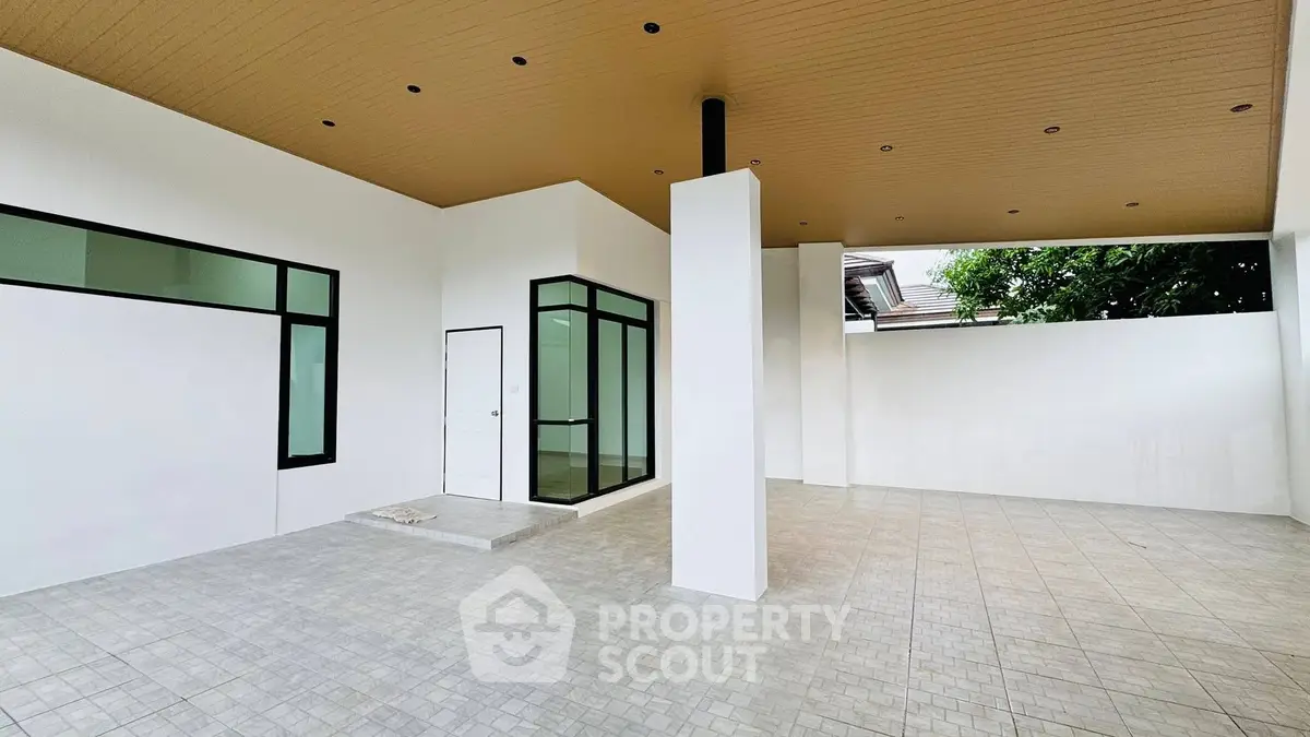 Spacious modern covered parking area with sleek design and ample natural light.