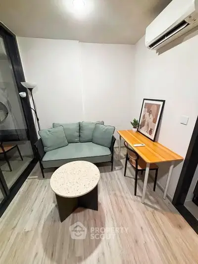 Cozy modern living room with stylish furniture and air conditioning