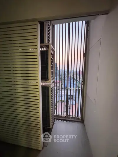 Modern apartment balcony with city view and sleek design