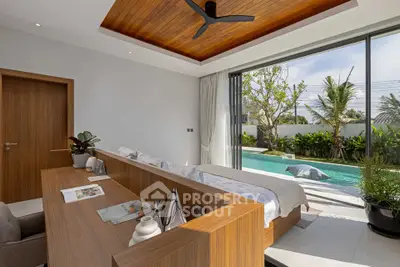 Luxurious bedroom with pool view and modern wooden accents
