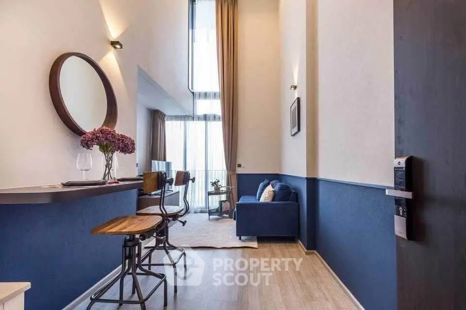 Modern living room with high ceiling and stylish decor