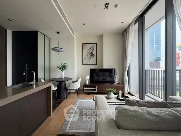 Modern living room with open kitchen and city view balcony in luxury apartment.