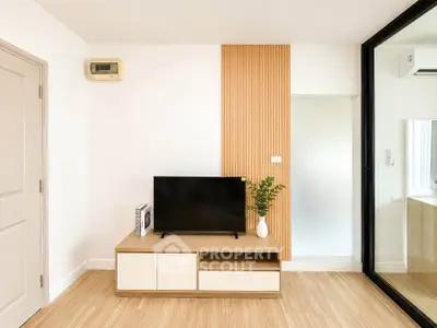 Modern living room with sleek TV stand and wooden accent wall