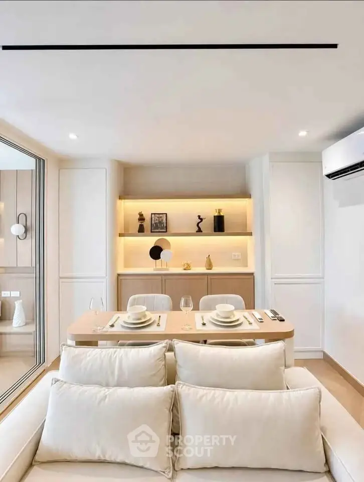 Modern living room with elegant dining area and stylish decor