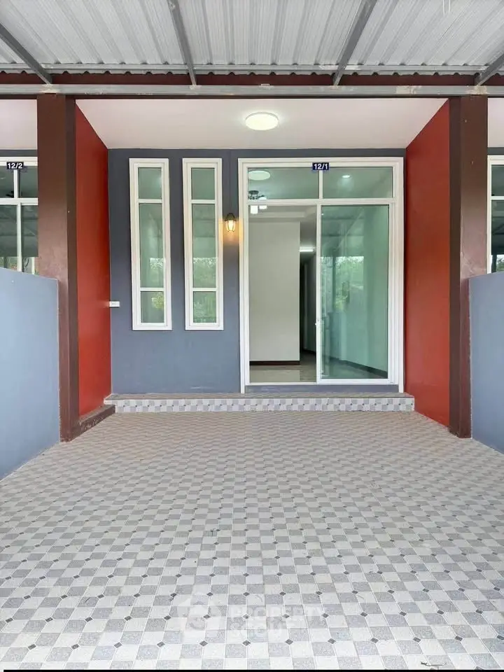 Modern townhouse entrance with stylish facade and covered porch