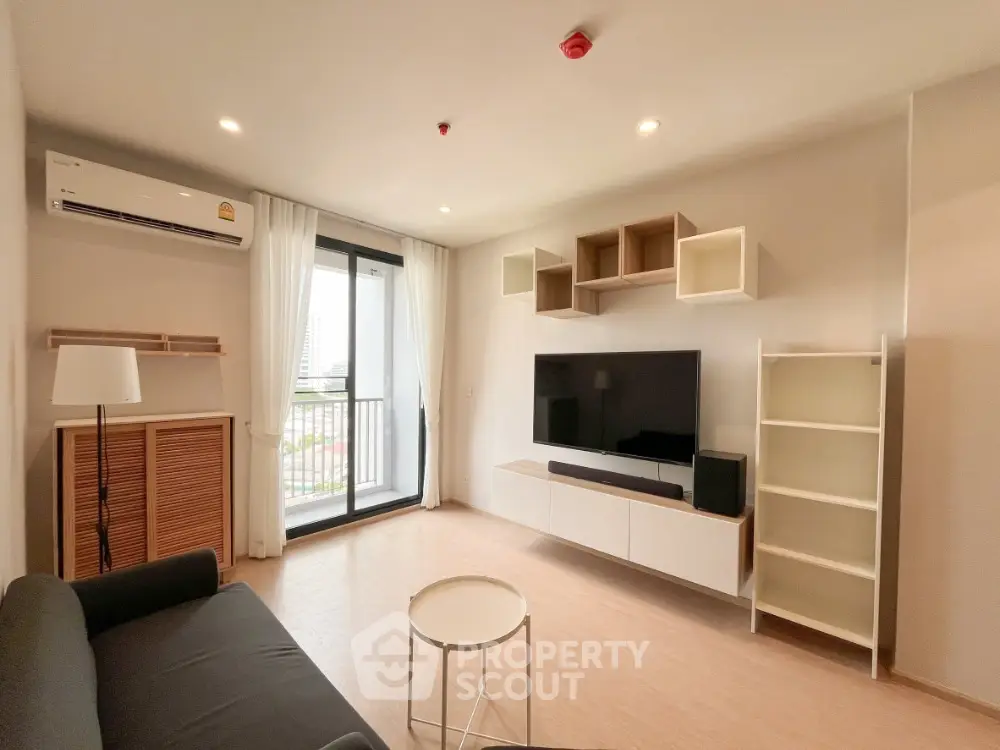 Modern living room with balcony view and stylish furniture