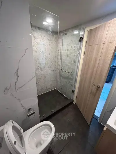 Modern bathroom with glass shower and sleek design