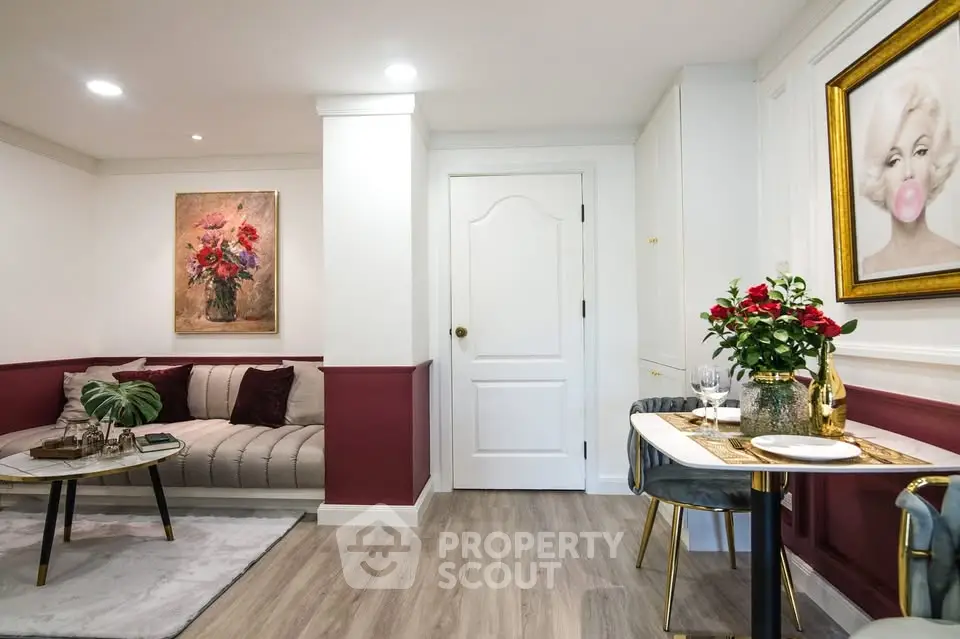 Chic living room with modern decor and stylish artwork, perfect for urban living.