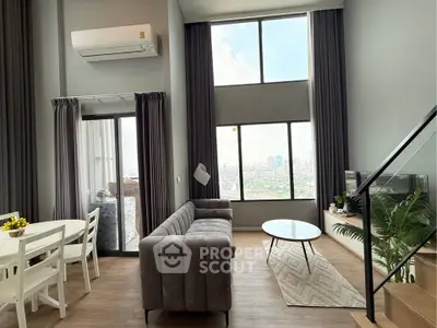 Modern high-ceiling living room with large windows and city view